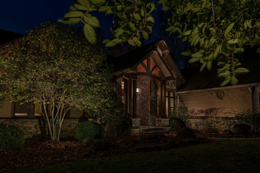 An outdated outdoor lighting system upgrade on the exterior of a home.